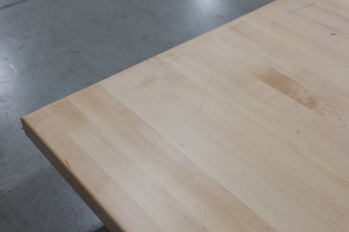 Light scratch near the corner, small mark on the edge